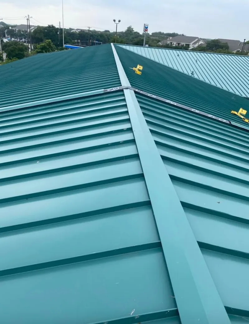 Green commercial metal roof ridge and valley for Metal Roof Repair in Fredericksburg
