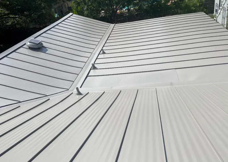 Solar attic fan installed on a metal roof for Roof Ventilation in Fredericksburg